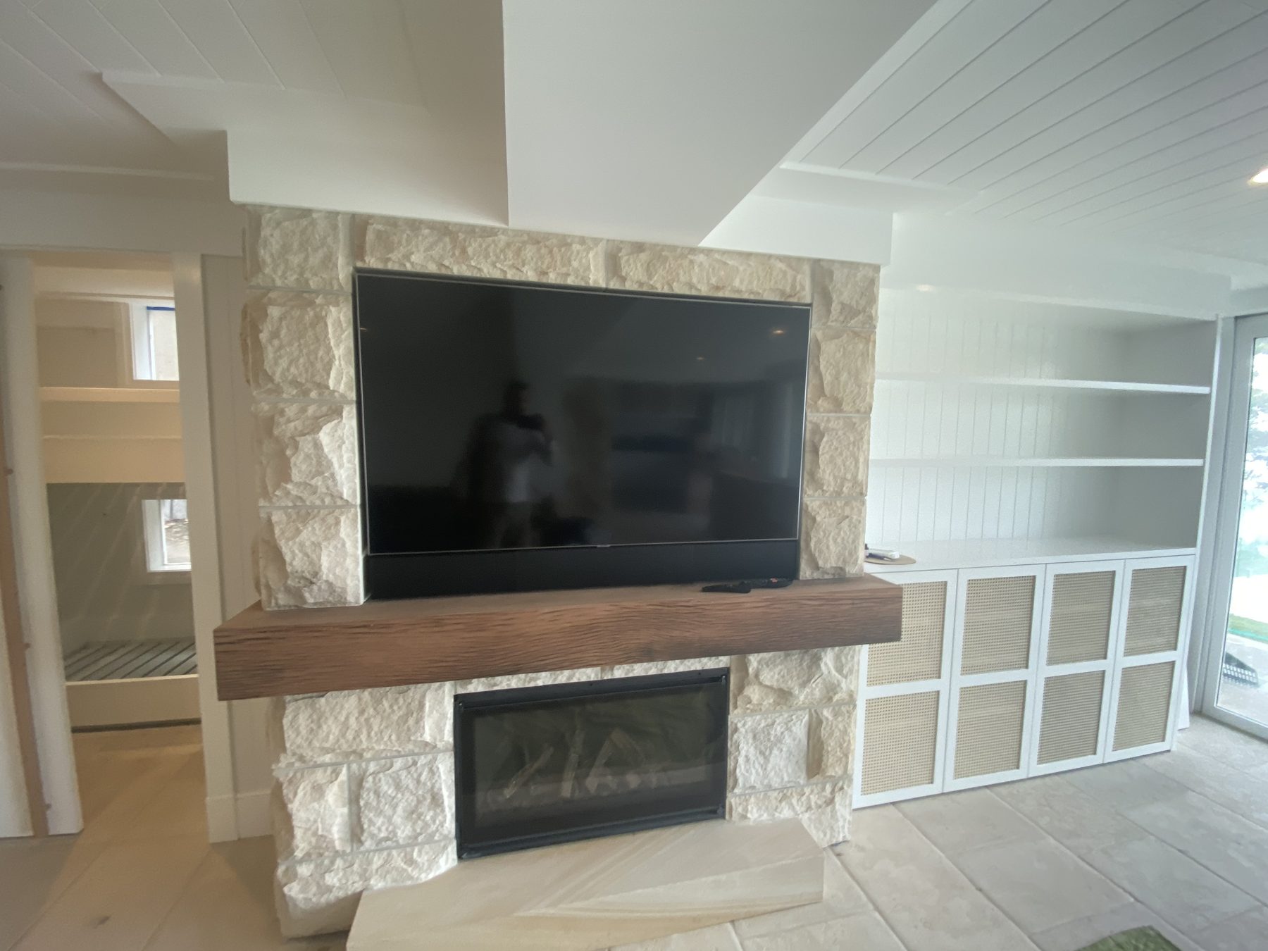 Stone fireplace and shelving